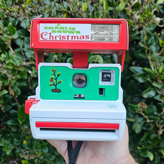 A Charlie Brown Snoopy Polaroid Camera