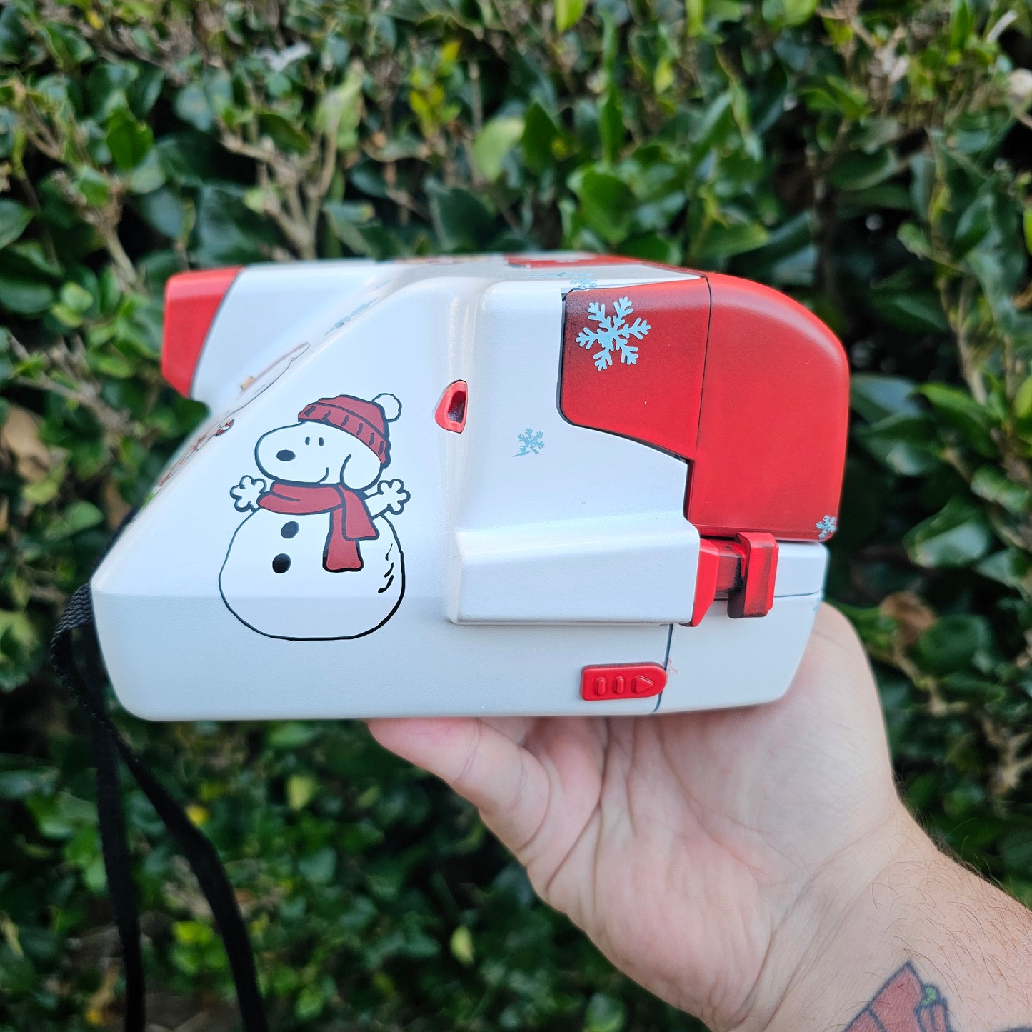 A Charlie Brown Snoopy Polaroid Camera