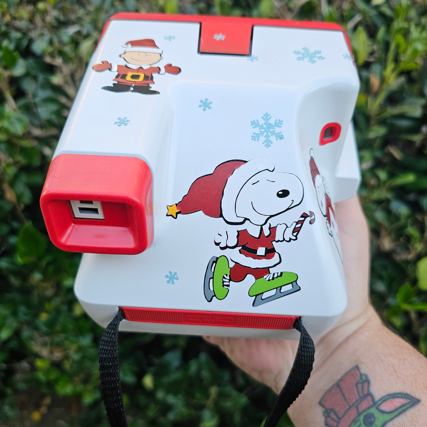 A Charlie Brown Snoopy Polaroid Camera