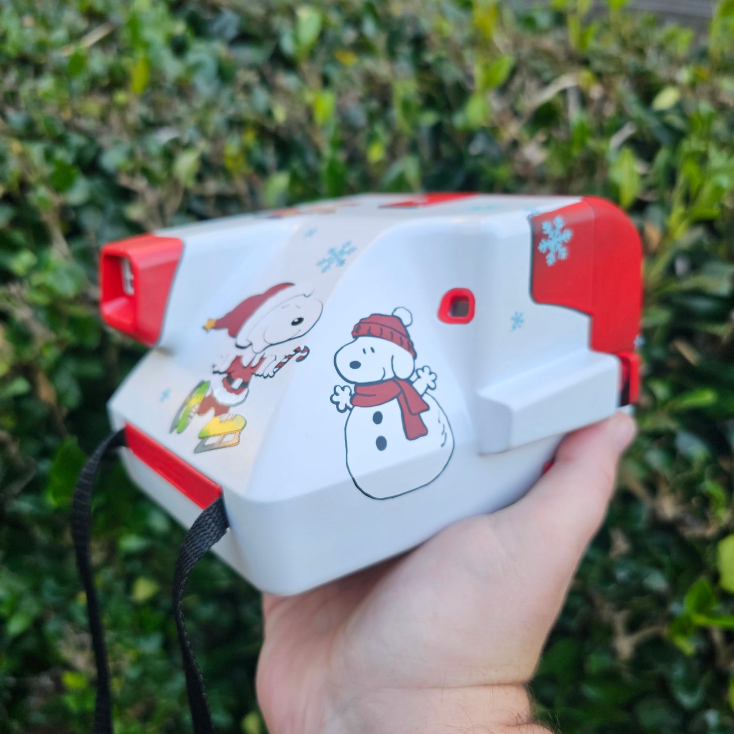 A Charlie Brown Snoopy Polaroid Camera